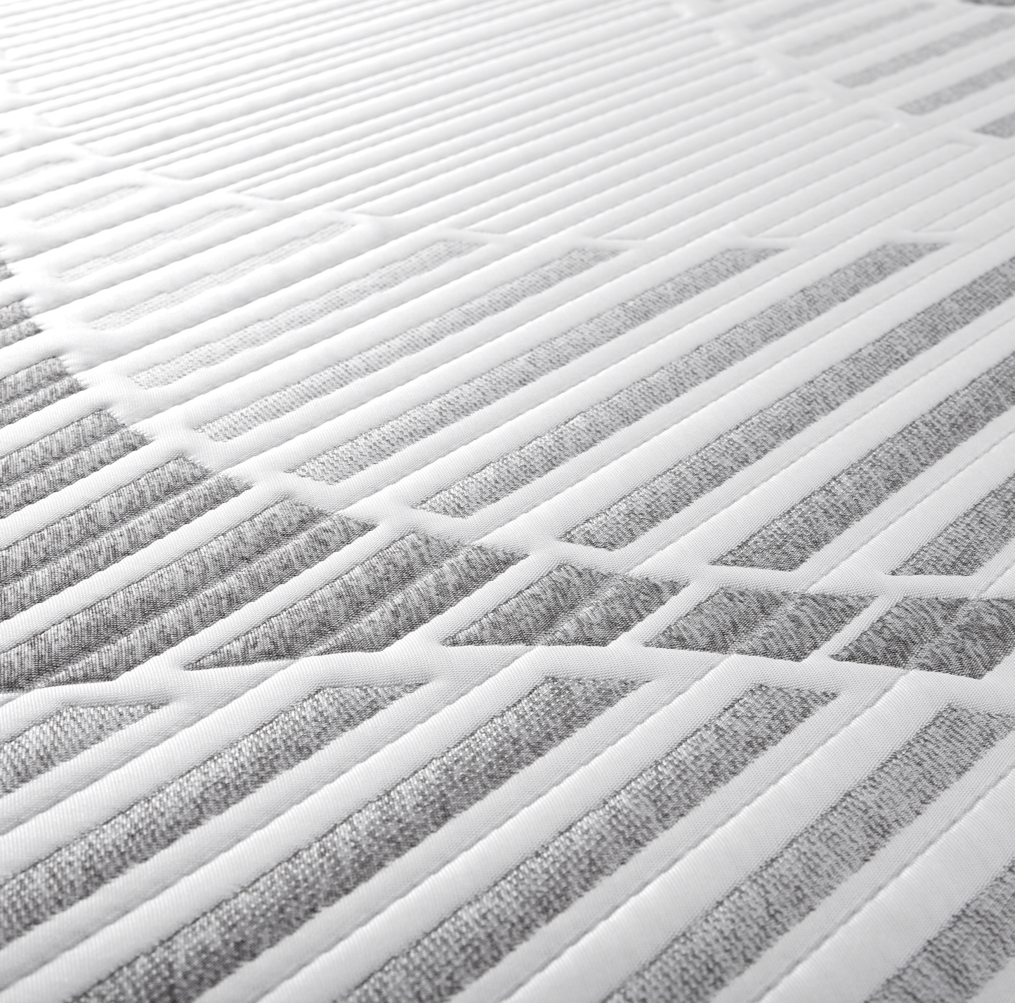 Sopor 14" Luxury Hybrid Mattress close up angle of top fabric showing off the white and grey pattern. Modern style in tight alternating pattern.