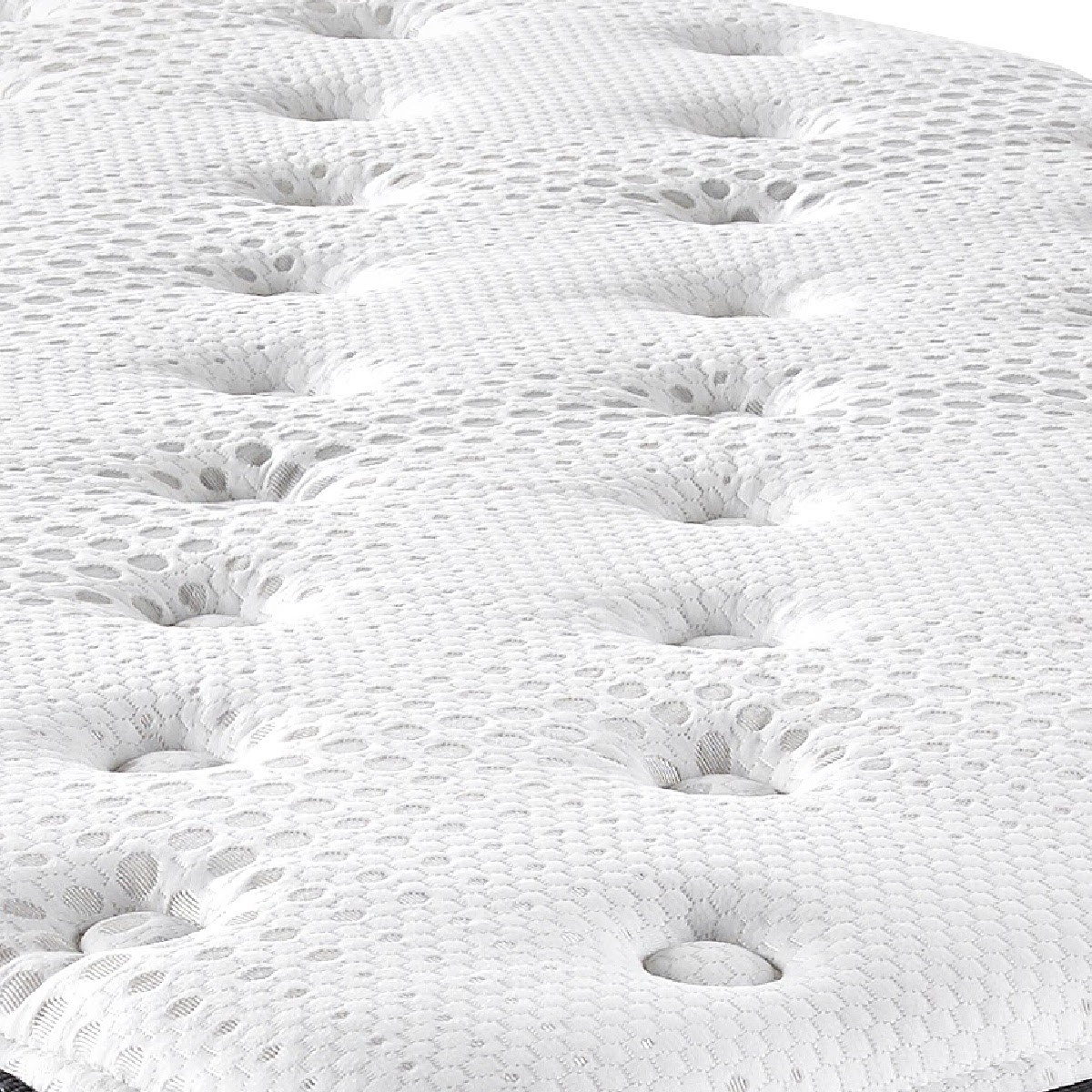 Lull 12" Hybrid Mattress close up of top. White circle stich quilting with small grey circular texture. 